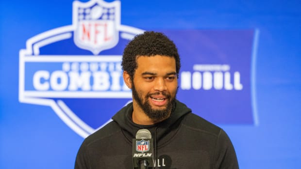 Caption: Mar 1, 2024; Indianapolis, IN, USA; Southern California quarterback Caleb Williams (QB14) talks to the media during the 2024 NFL Combine at Lucas Oil Stadium. Mandatory Credit: Trevor Ruszkowski-USA TODAY Sports